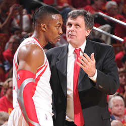 Dwight Howard listens to Kevin McHale